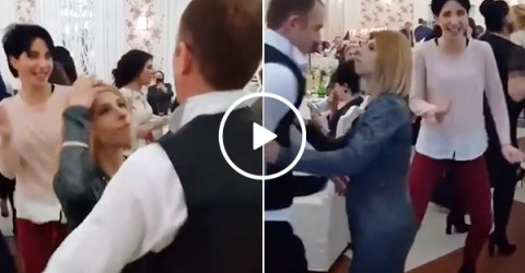 Jealous wife really, really doesn't like sharing the dance floor (Video)