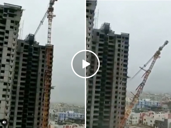 A construction crane can't handle the fierce winds of a cyclone (Video)