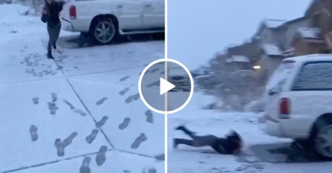 Sister takes a very painful face-plant after losing a snowball fight (Video)