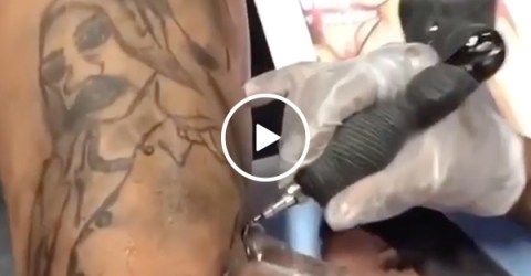 He... he just sat there and let that tattoo happen? (Video)