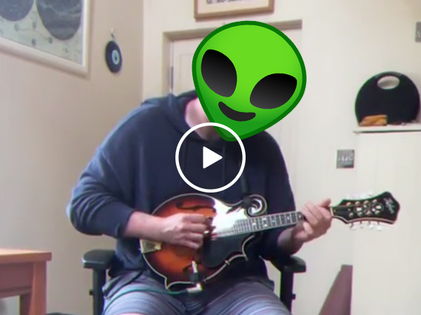 Eerie 90s theme shredded on the mandolin by guy in socks and sandals (Video)