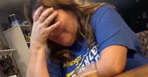 Oblivious mom has drink swapped with a candle (Video)